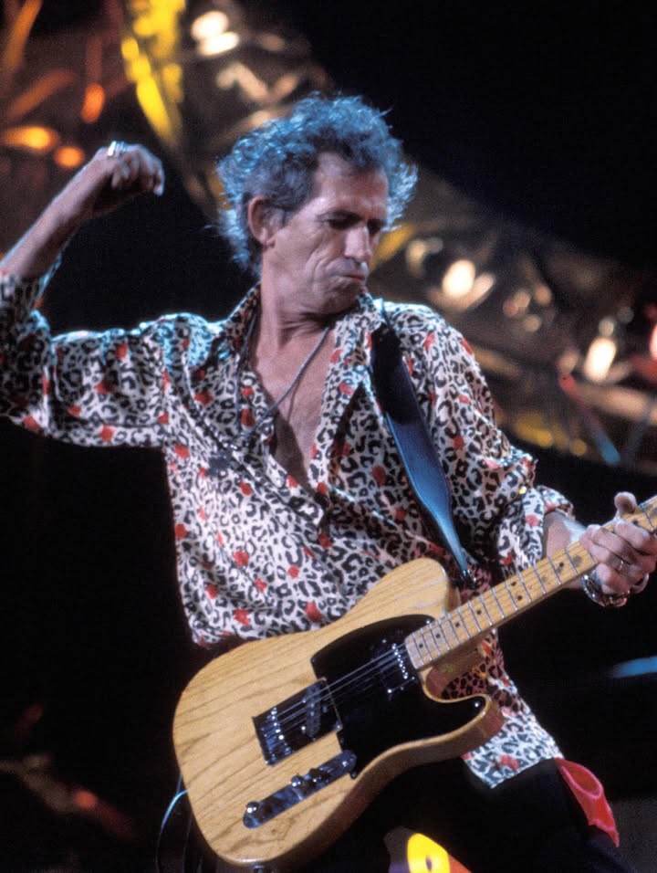 May be an image of guitar and text