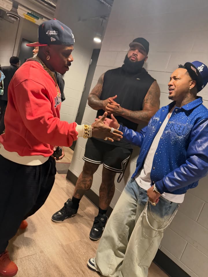 May be an image of one or more people, people standing and text