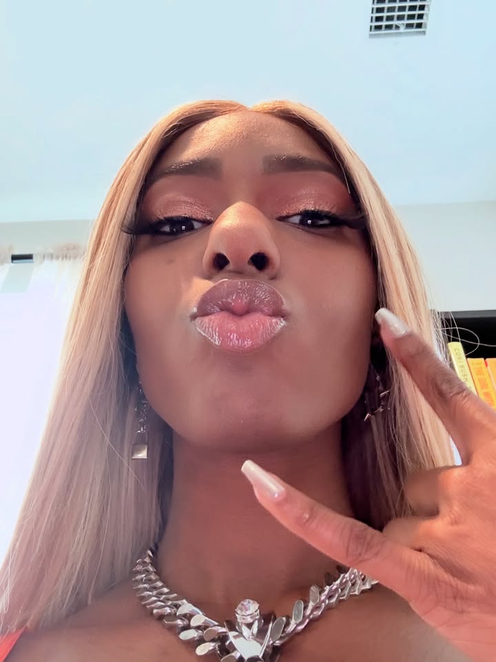 May be a selfie of one or more people, blonde hair, makeup and choker