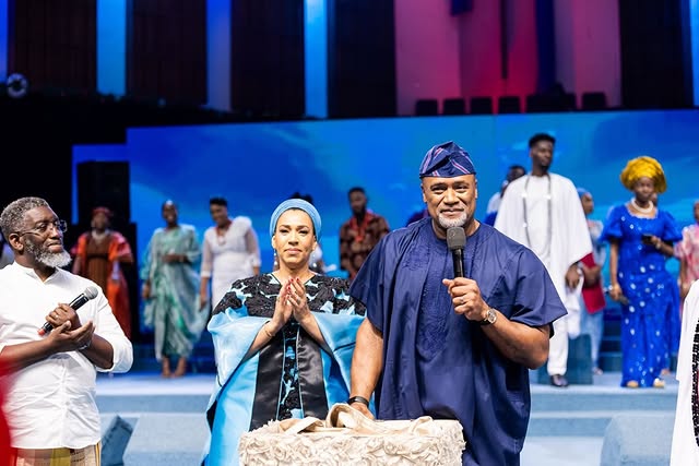 May be an image of one or more people, costume, dais and text