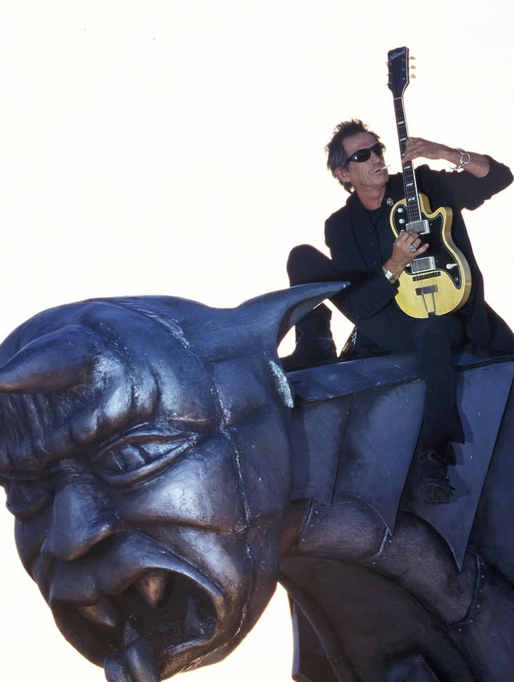 May be an image of guitar and text