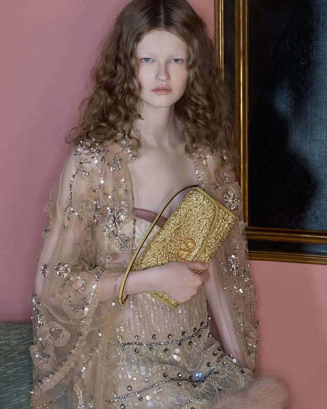 May be an image of one or more people, makeup and text