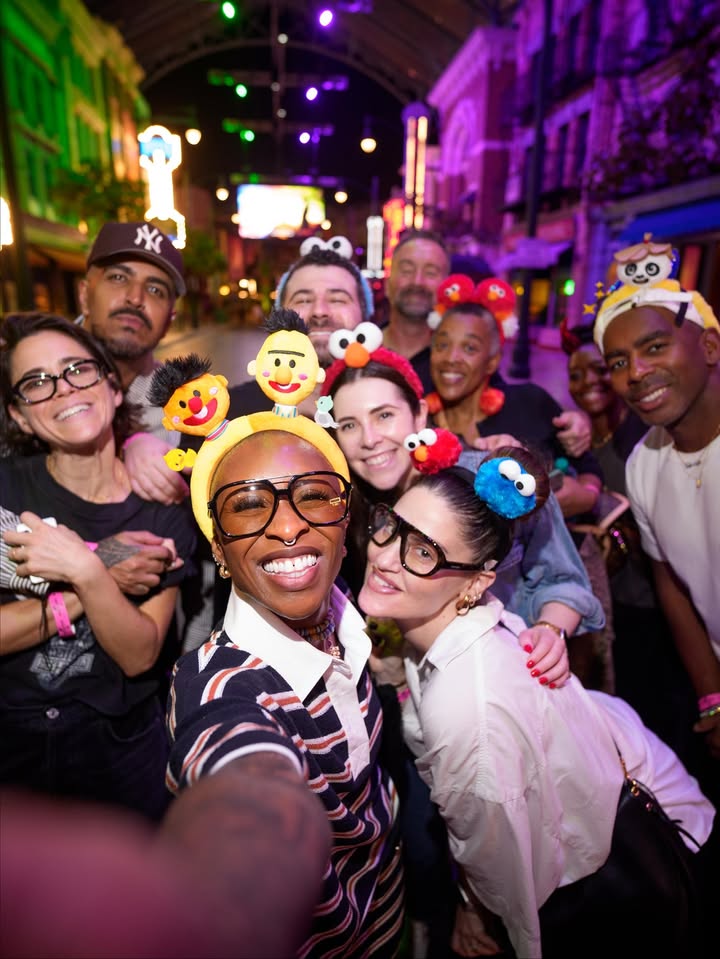 May be an image of one or more people, eyewear, headdress, crowd and text