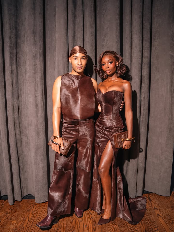 May be an image of leather, gown, dress and text