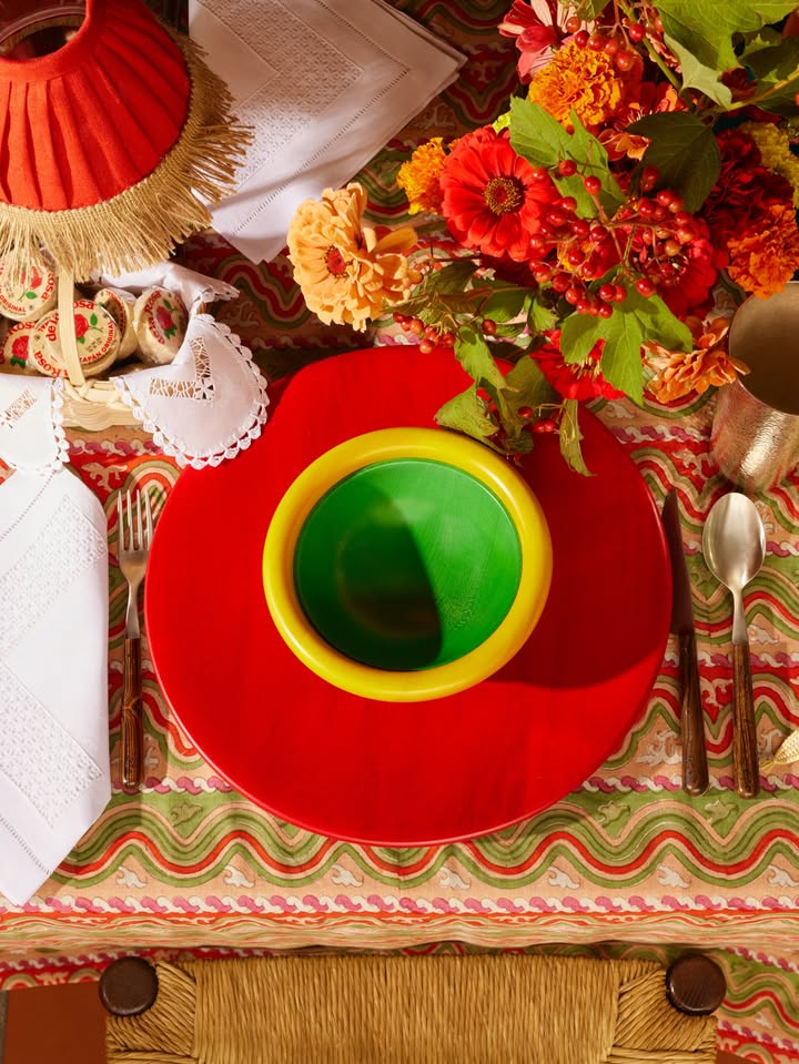 May be an image of napkin ring, cutlery, chinaware, placemat, napkin, tablecloth and text