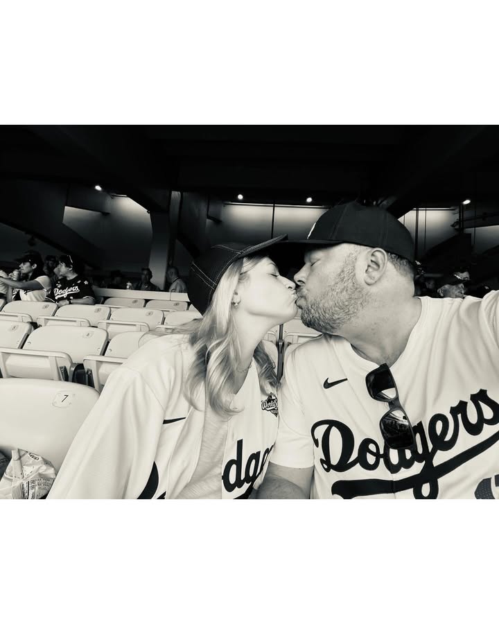 May be an image of people kissing and baseball