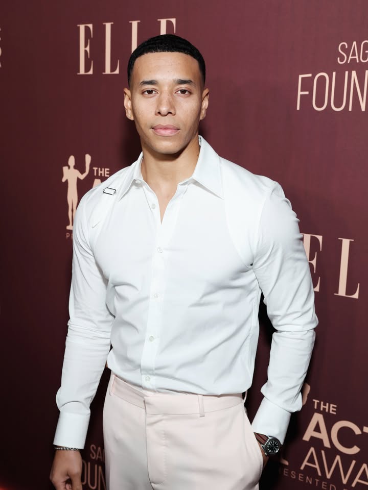 May be an image of dinner jacket, carpet and text that says 'ELI" SAG FOUN THE EL L THE THE AC AWA'