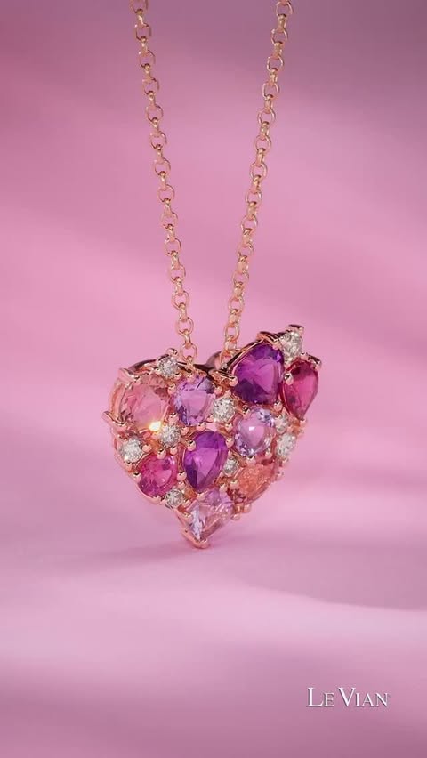 A heart-shaped necklace, filled with gems of pink and purple hues in all shapes and sizes.