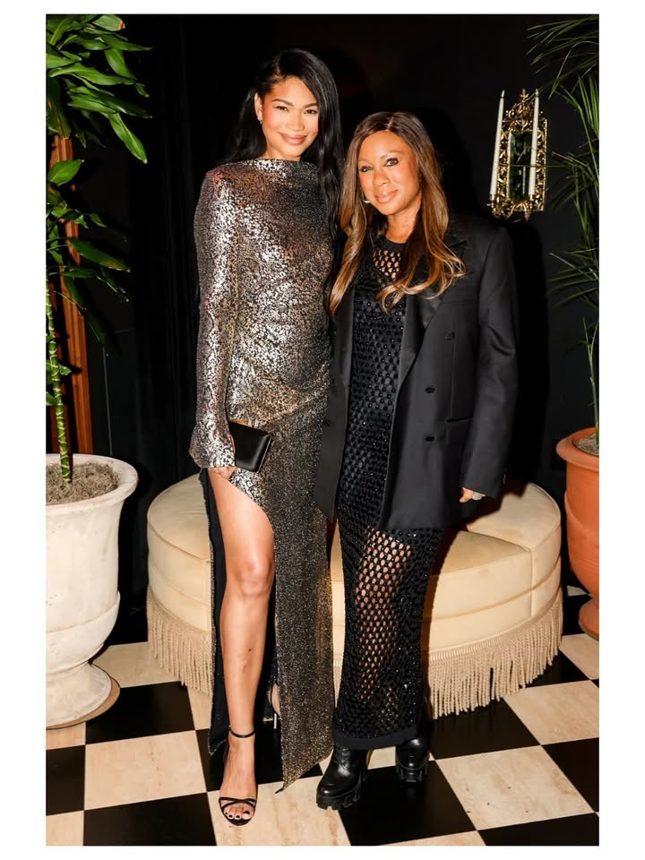 May be an image of suit, dress and text