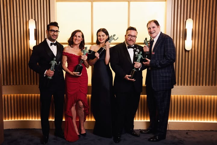 May be an image of one or more people, suit, dinner jacket, wedding and text