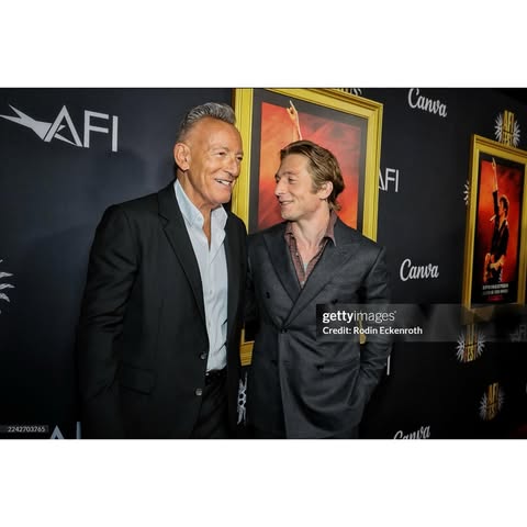 May be an image of one or more people, carpet and dinner jacket