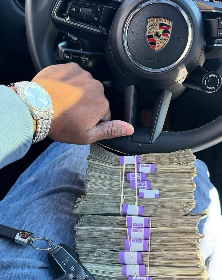 May be an image of money, wrist watch and text