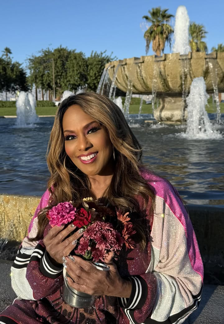 May be an image of one or more people, makeup, shawl, jacket and fountain