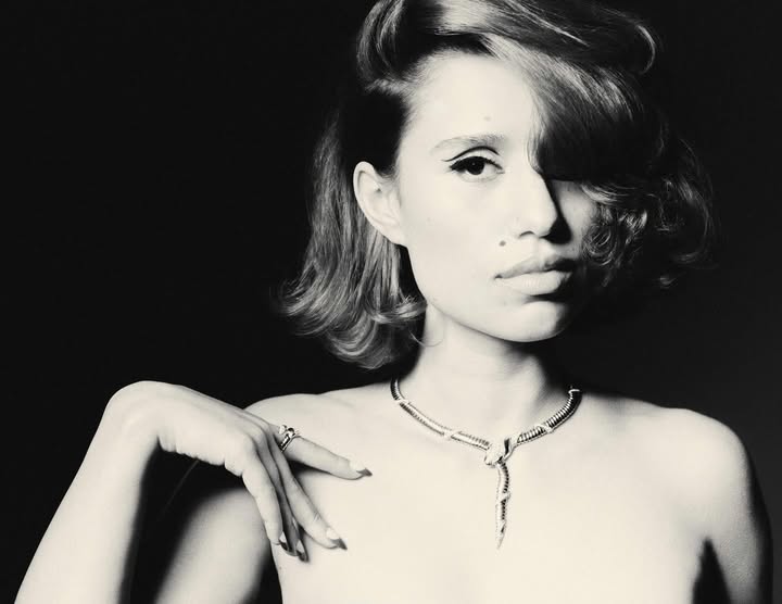 May be a black-and-white image of one or more people, hair, makeup and text