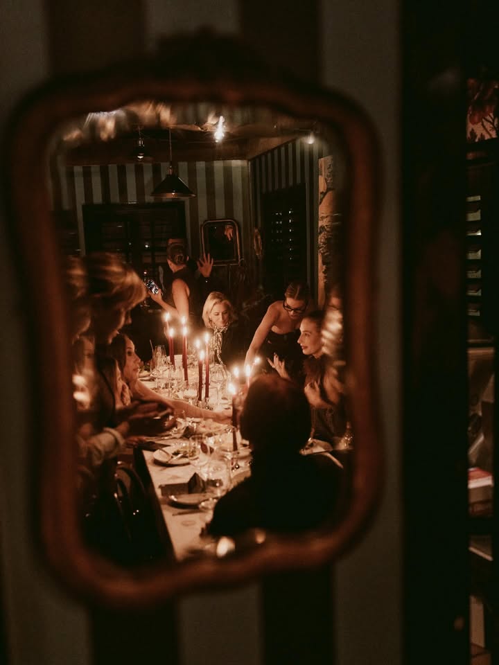 May be an image of candle holder, mirror, candle and text