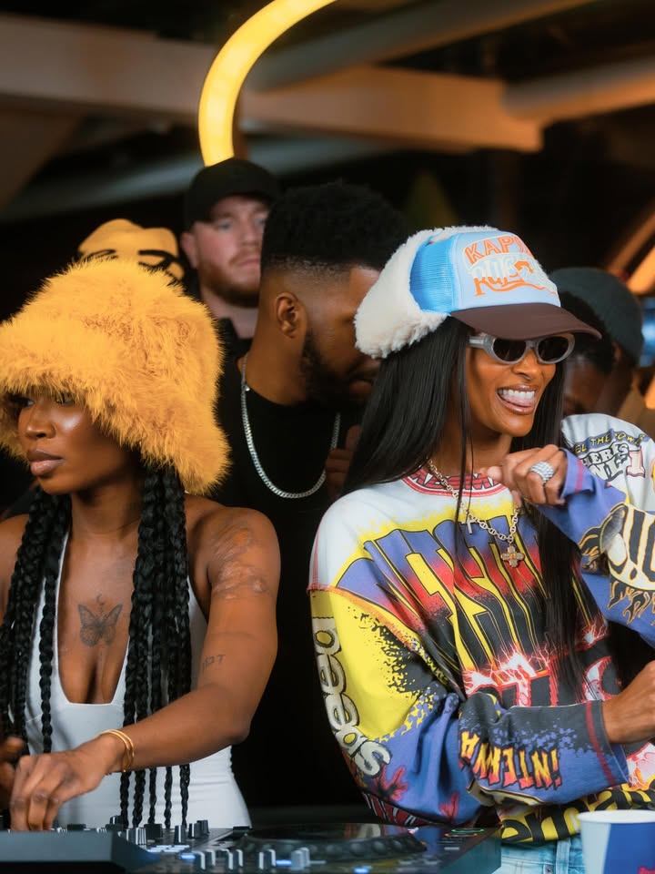 May be an image of one or more people, eyewear, hat, beret, headscarf, crowd and text