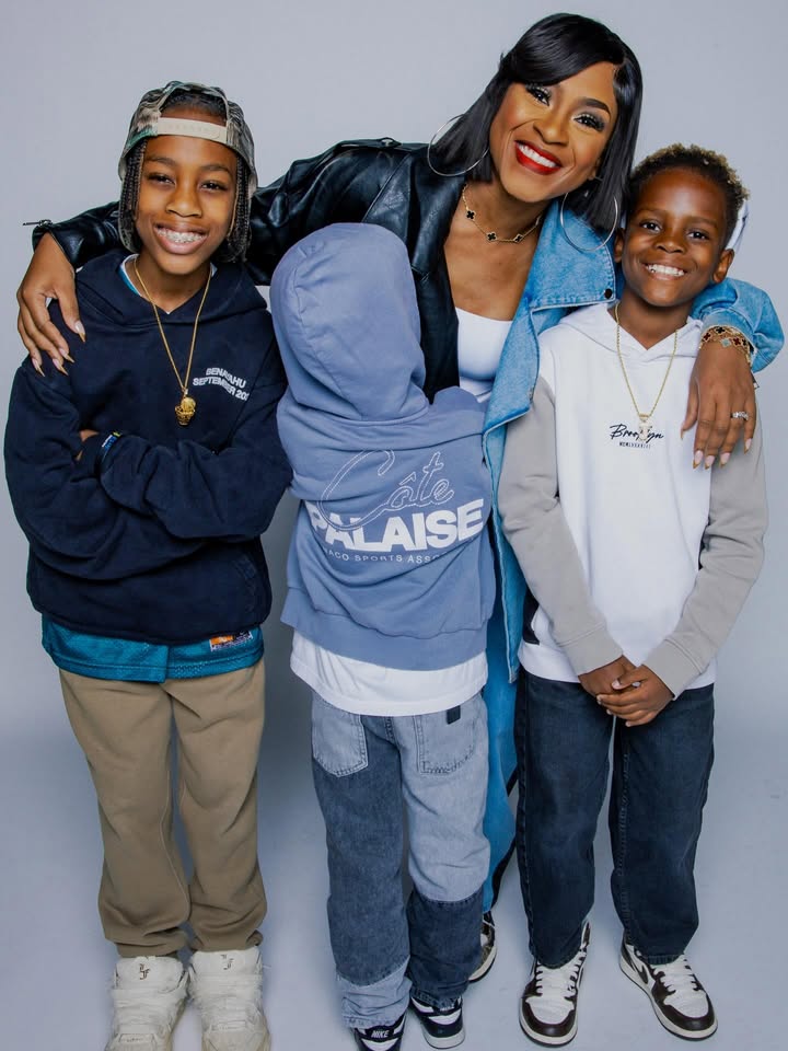 May be an image of child, smiling, fleece, sweatsuit, sweatshirt and text