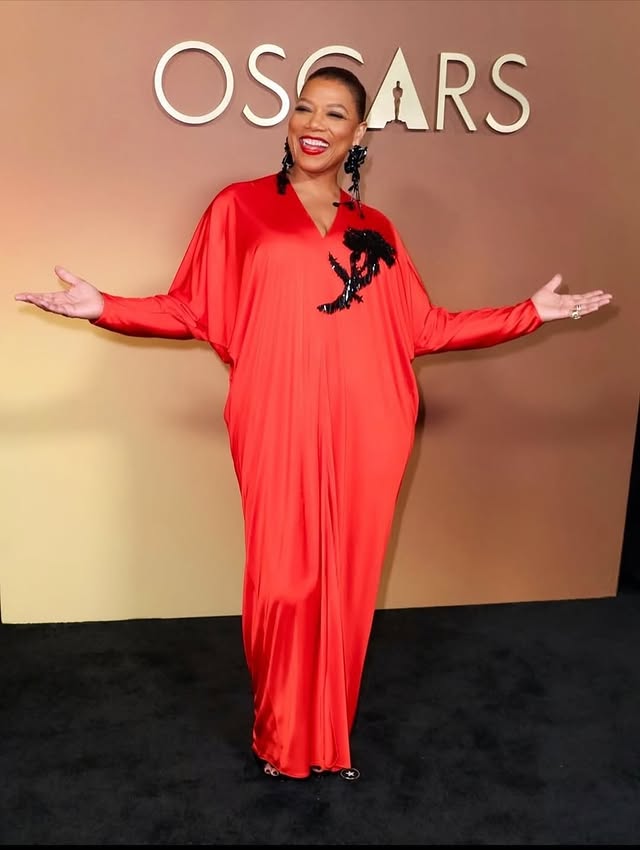 May be an image of gown, carpet and text