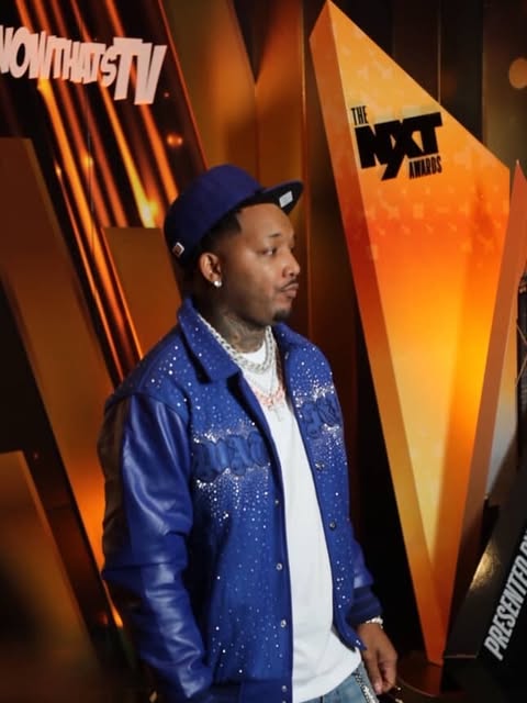 May be an image of one or more people, people standing, magazine, jacket and text