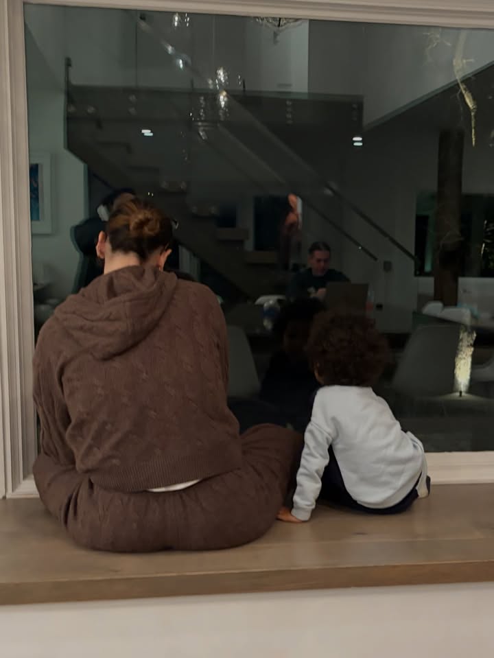 May be an image of sweatsuit, sweatpants and text