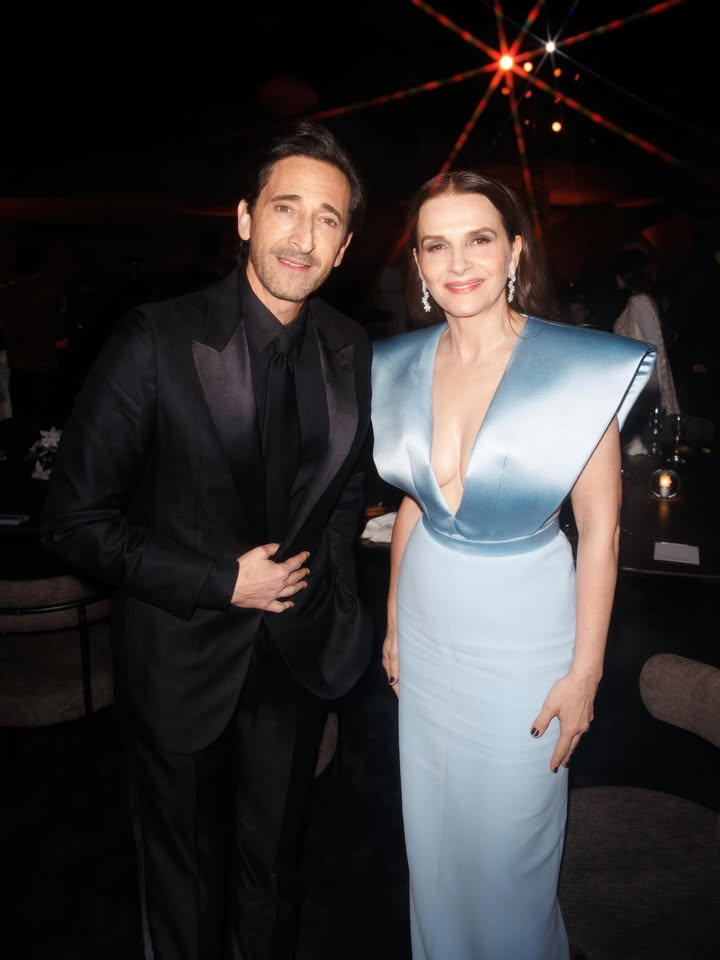 May be an image of dress, carpet, dinner jacket, gown and text