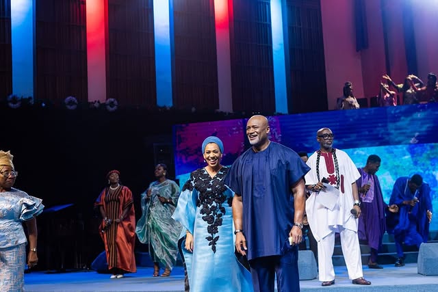 May be an image of one or more people, dais and text