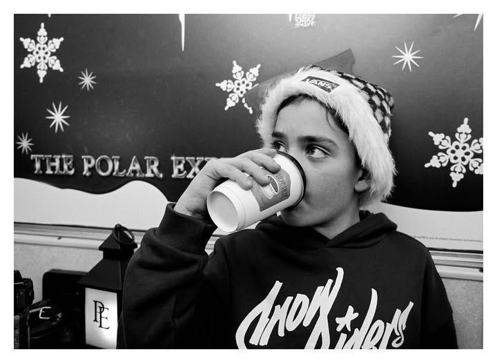 May be a black-and-white image of sweater, cup and text that says 'は ANS THE POLAR THEPOLAREY EX PE cnow *lers'