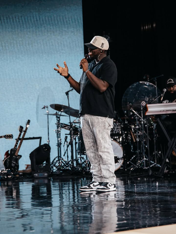 May be an image of microphone, concert and text