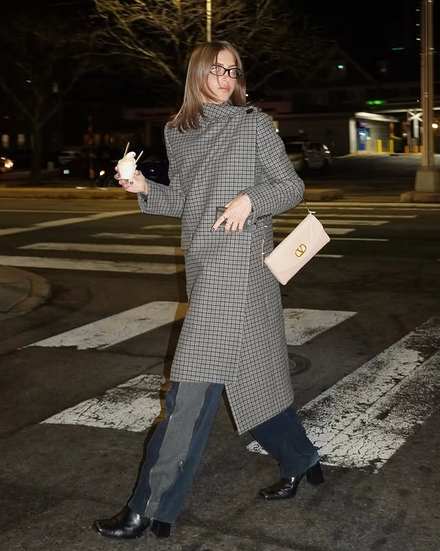 May be an image of overcoat, duffle coat, turtleneck and text