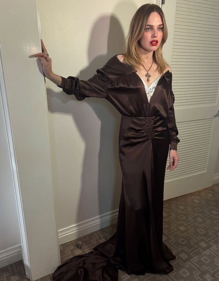 May be an image of slip, robe, dress and text