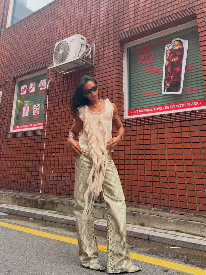 May be an image of jumpsuit