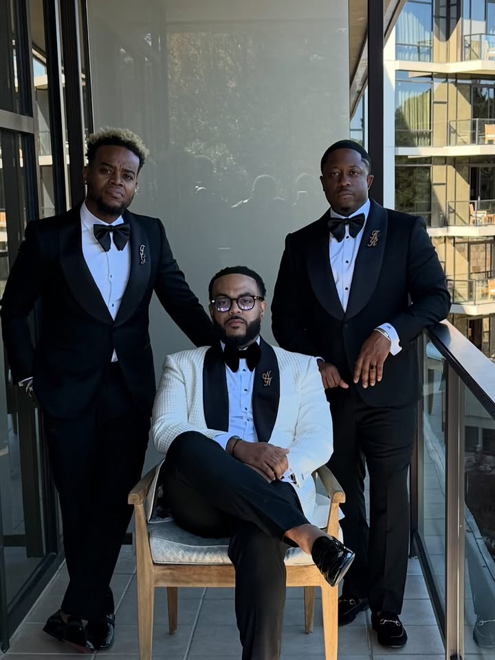 May be an image of suit, bowtie, bow, dinner jacket, blazer and text