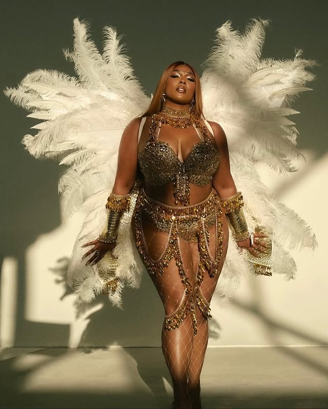 May be an image of one or more people, makeup, costume, headdress and fishnet stockings