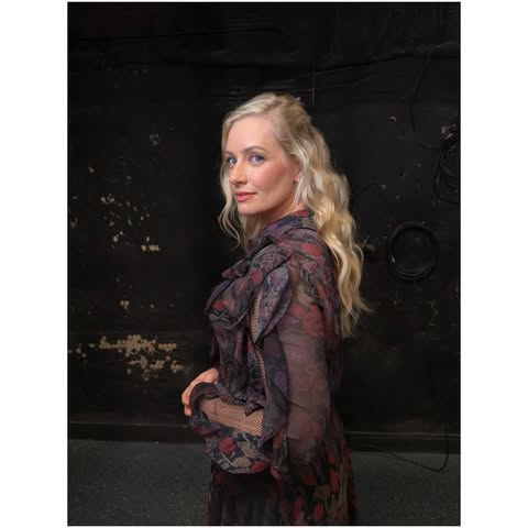 May be an image of one or more people, blonde hair, makeup and text