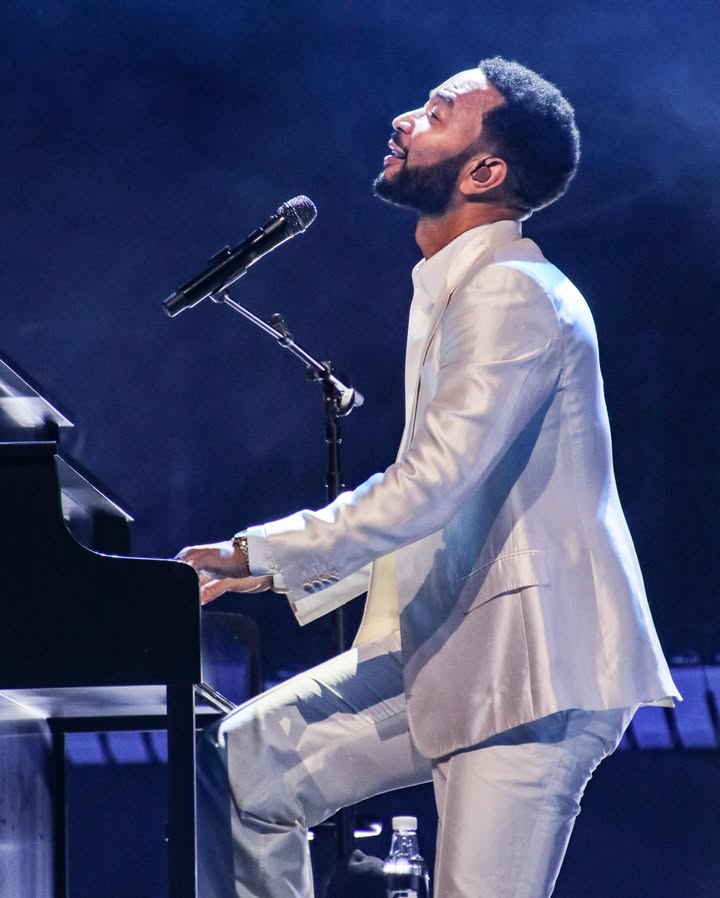 May be an image of piano, microphone, concert and text