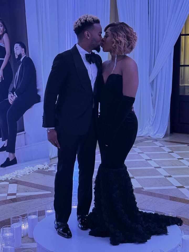 May be an image of one or more people, people kissing, dress, gown, dinner jacket, wedding and text