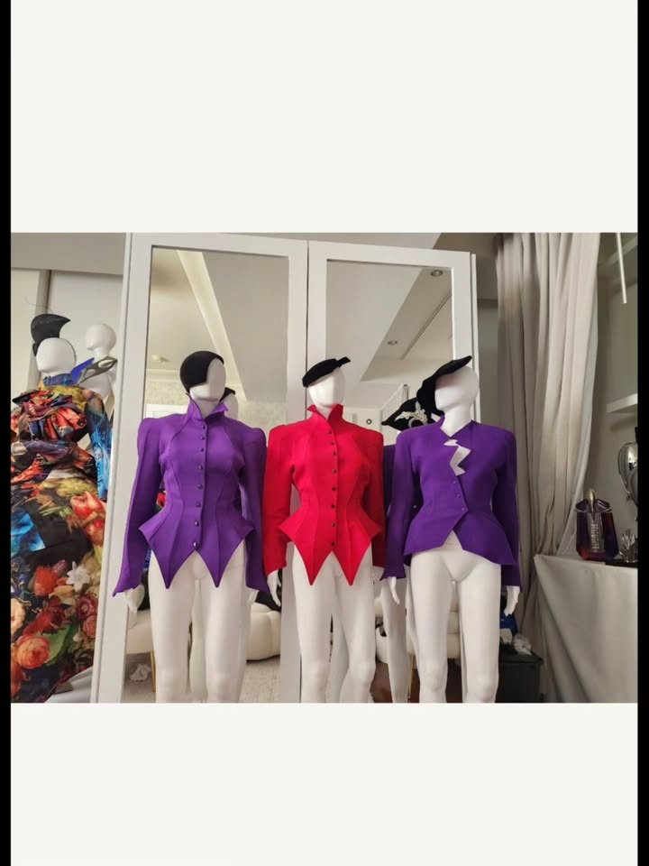 May be an image of suit, clothes hanger, mannequin, dinner jacket, display case, blazer and text