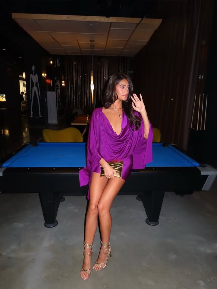 May be an image of billiards, slip, miniskirt and text