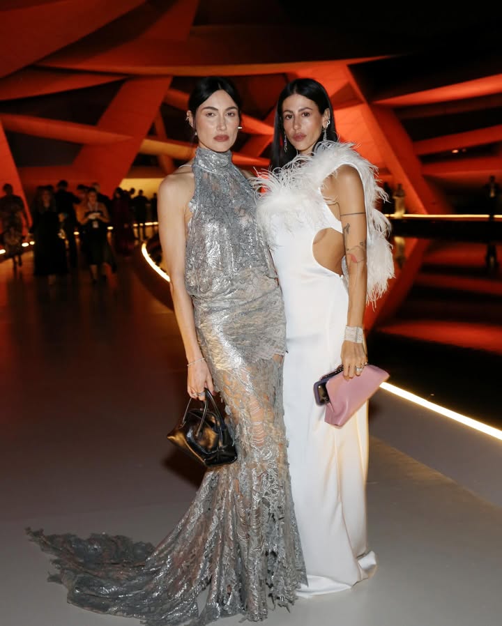 May be an image of gown, dress and text