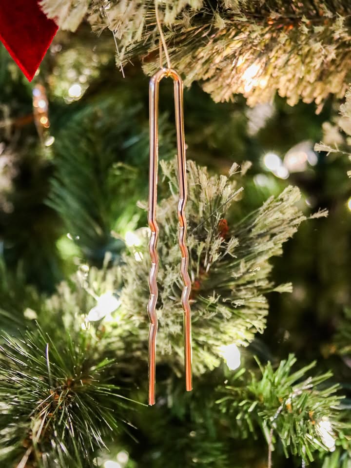 May be an image of christmas tree, copper, hairpin, chopsticks, tinsel and text