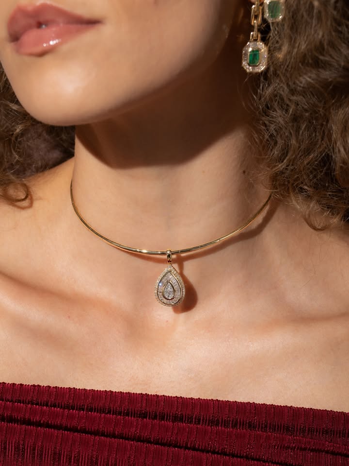 May be an image of necklace, choker and text