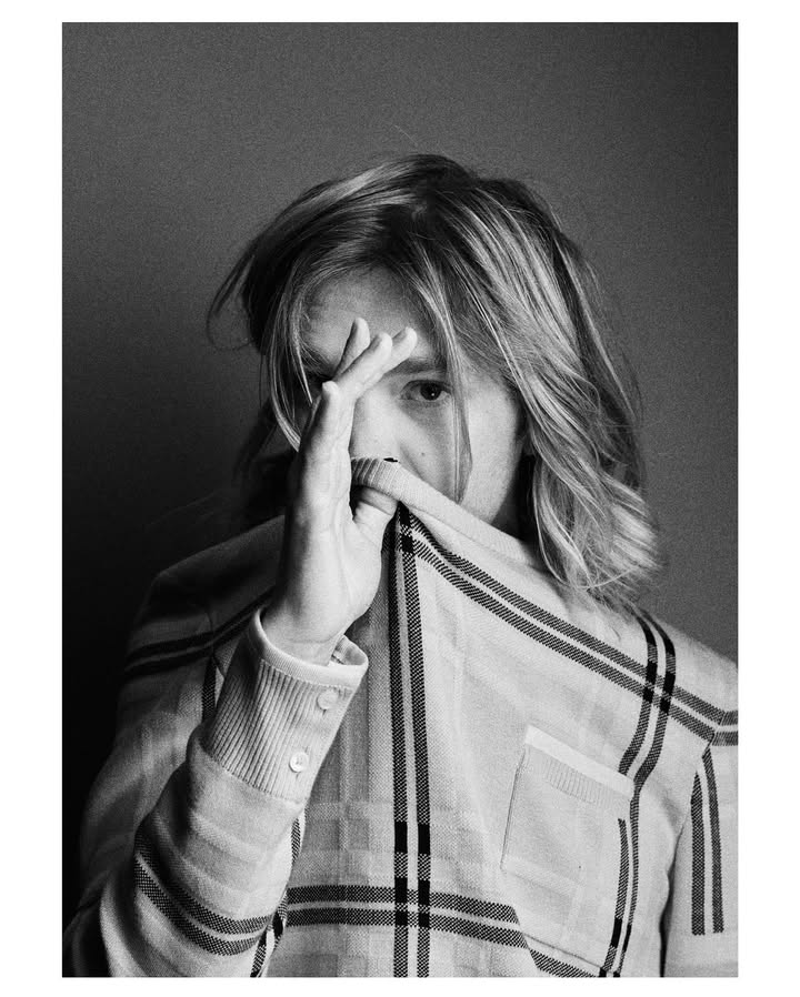 May be a black-and-white image of one or more people, makeup, people smoking and text