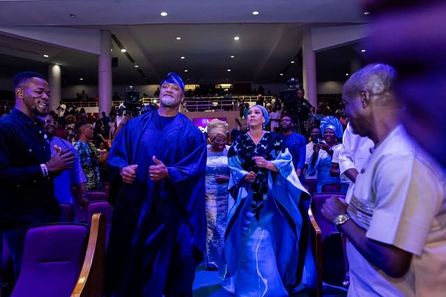 May be an image of one or more people, crowd and text