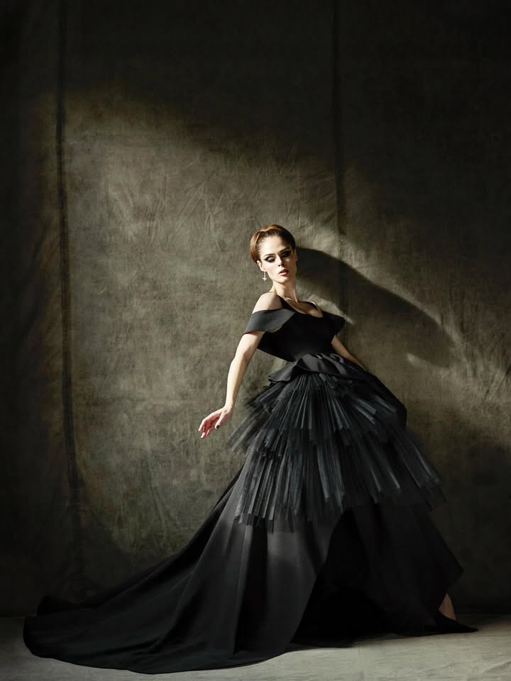 May be an image of dress, gown and text