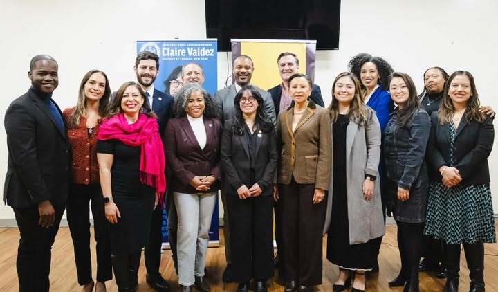 May be an image of one or more people, people standing, office and text