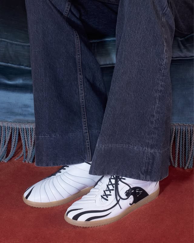 May be an image of wingtip shoes and text