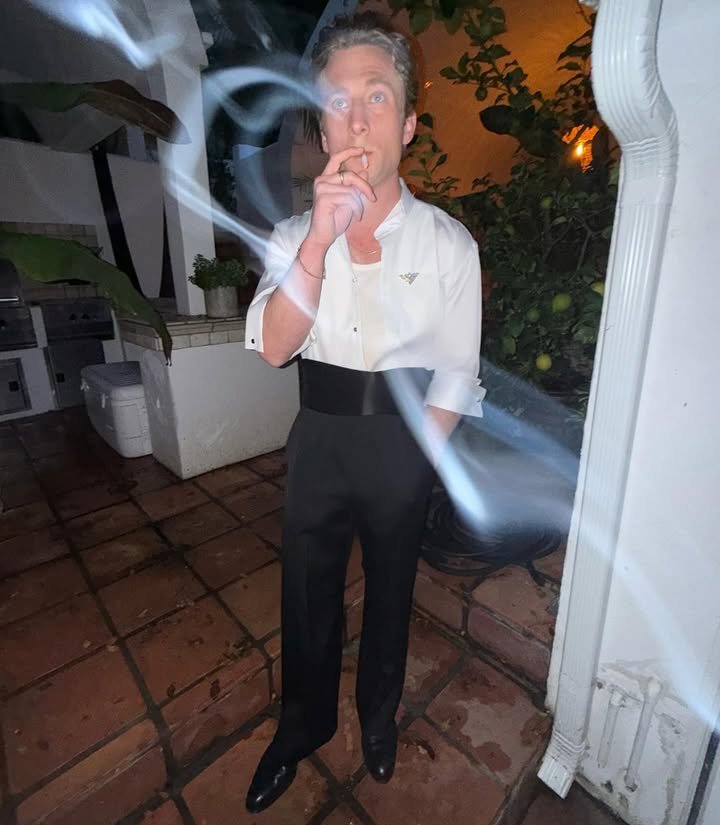 May be an image of smoking, wingtip shoes, cigarette, cigar and text