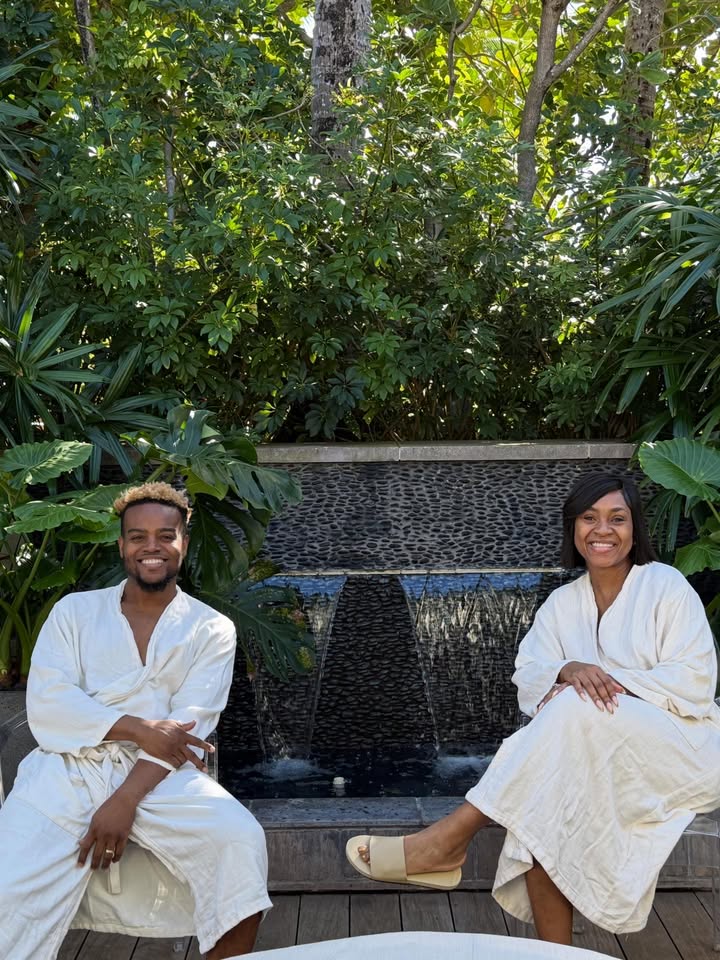 May be an image of bath robe, robe and text