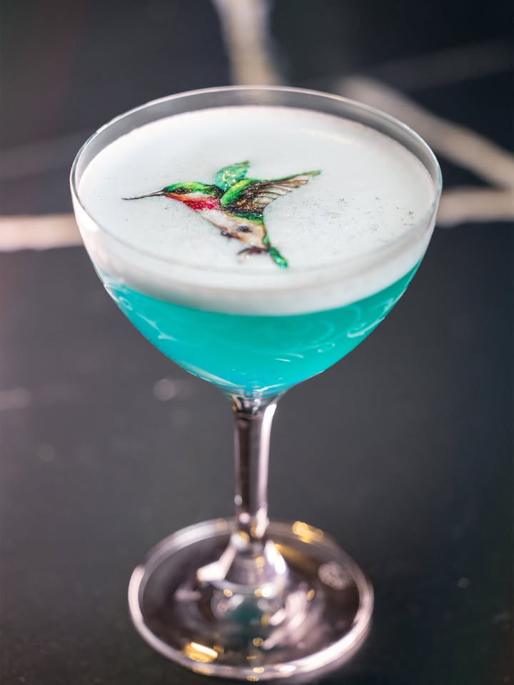 May be an image of cocktail and text