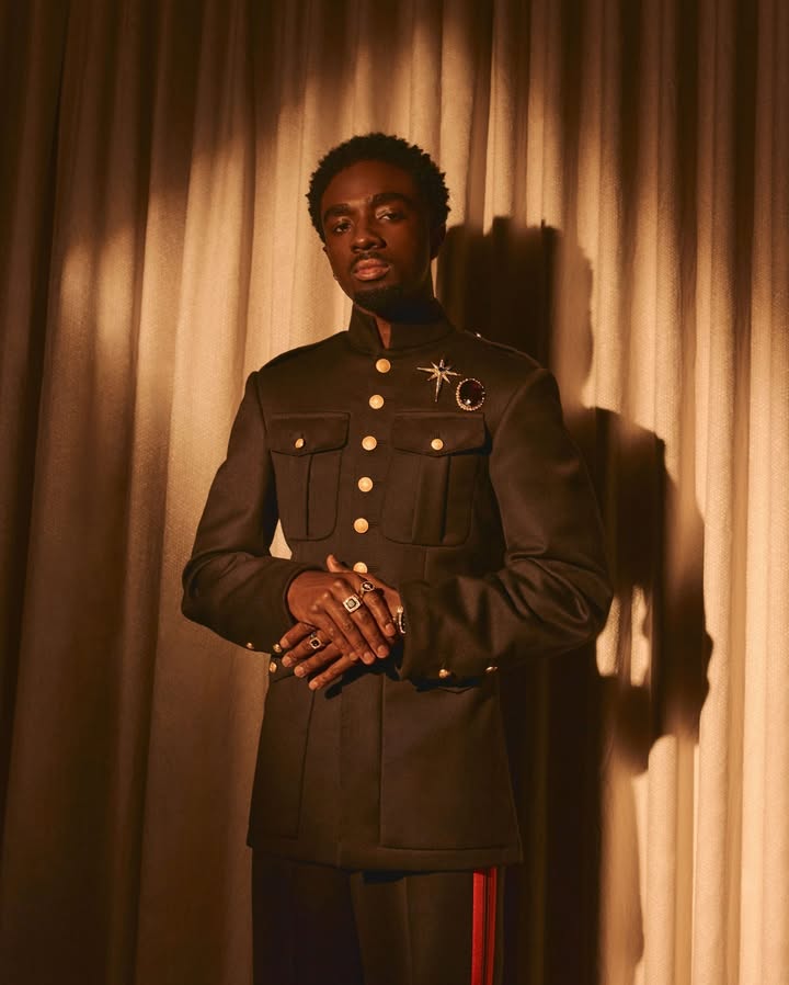 May be an image of suit, military uniform and text